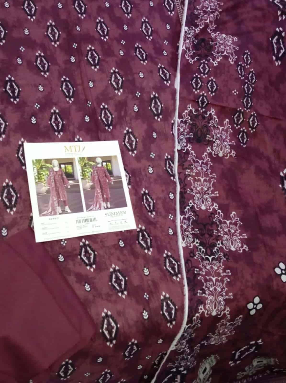 Elegant MTJ lawn 3 piece suit with intricate embroidery and vibrant design. Perfect for summer occas.