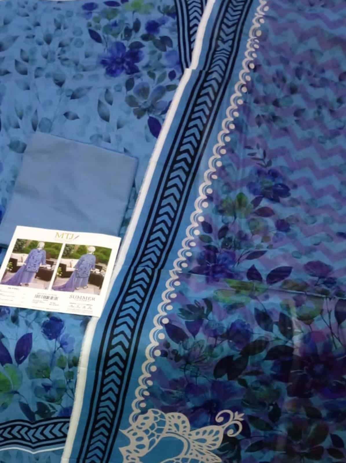 Elegant blue floral lawn fabric for stylish summer wear.